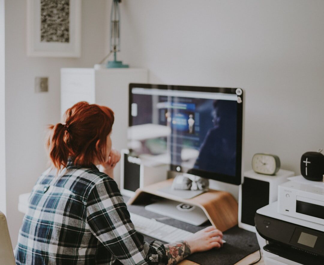 person editing text on computer