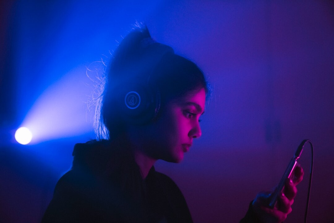 person wearing headphones listening to audio