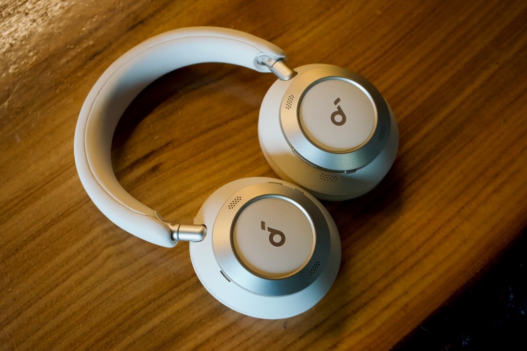 Wireless headphones on a wooden surface