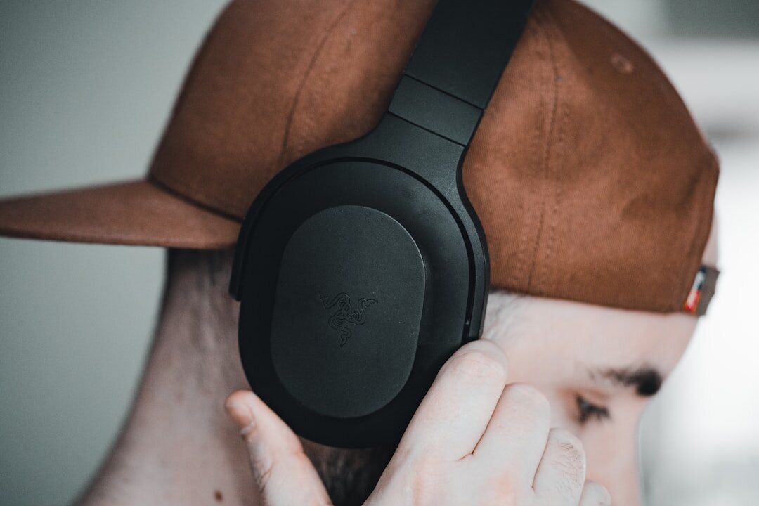 person wearing headphones listening to audio