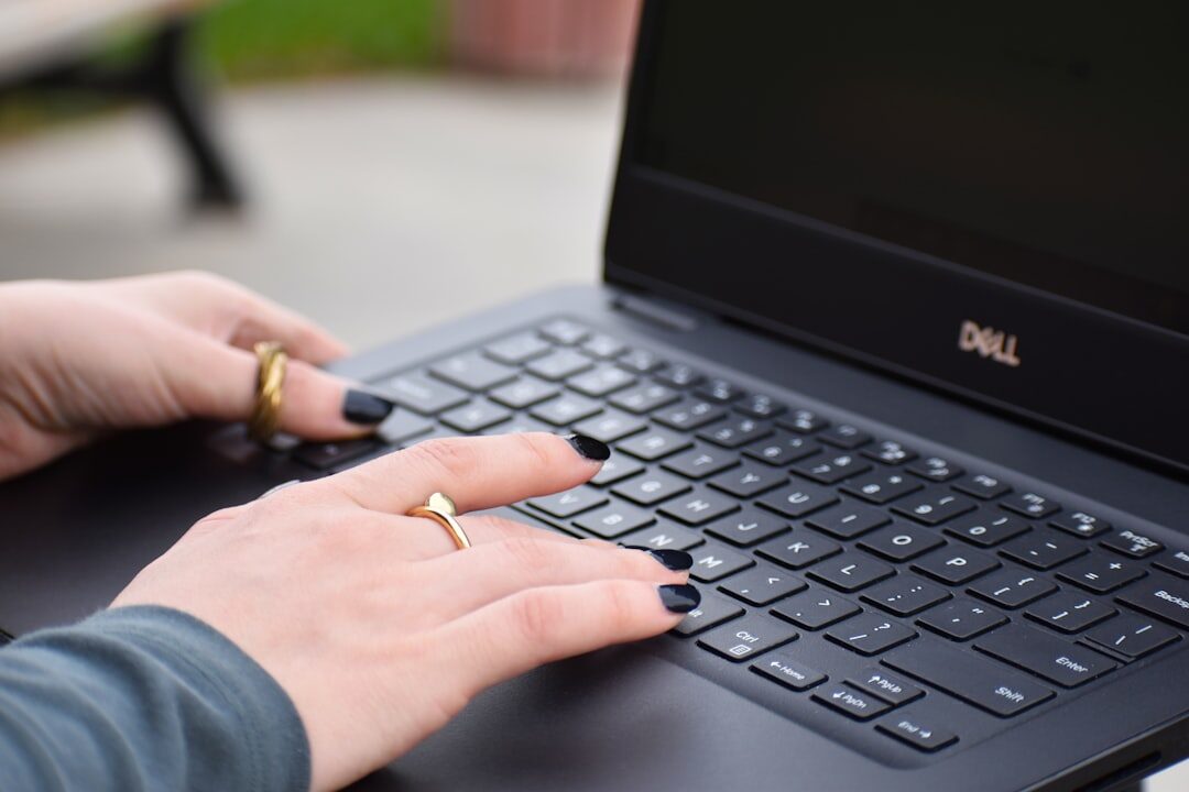 person typing on laptop