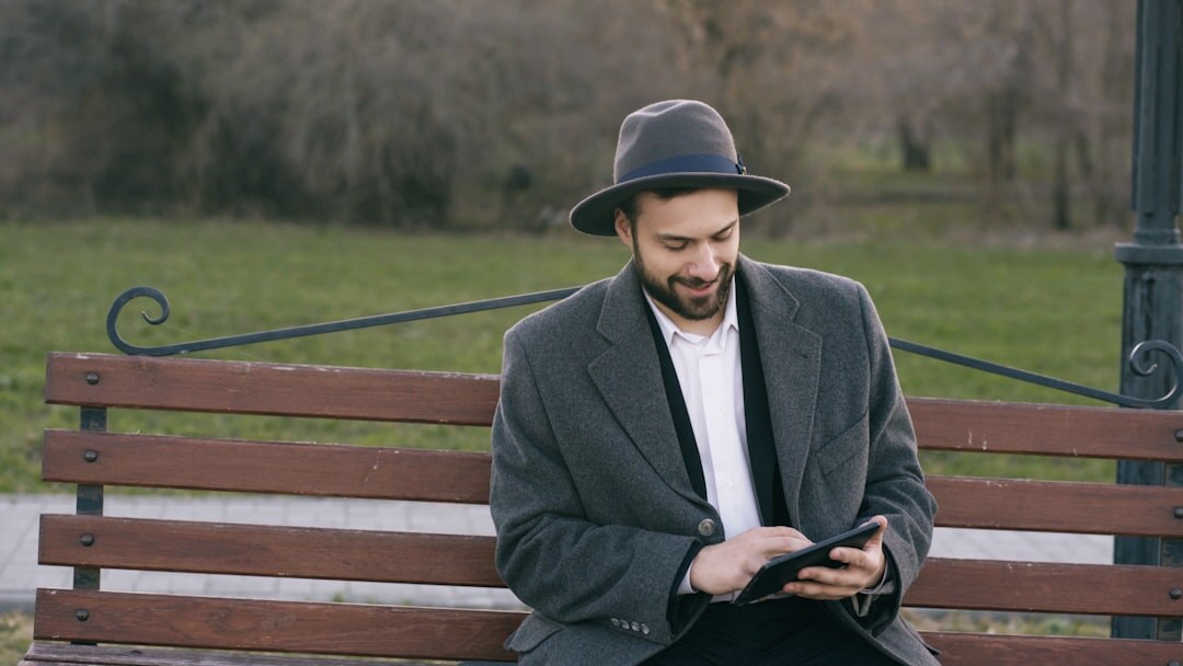 man reading on tablet
