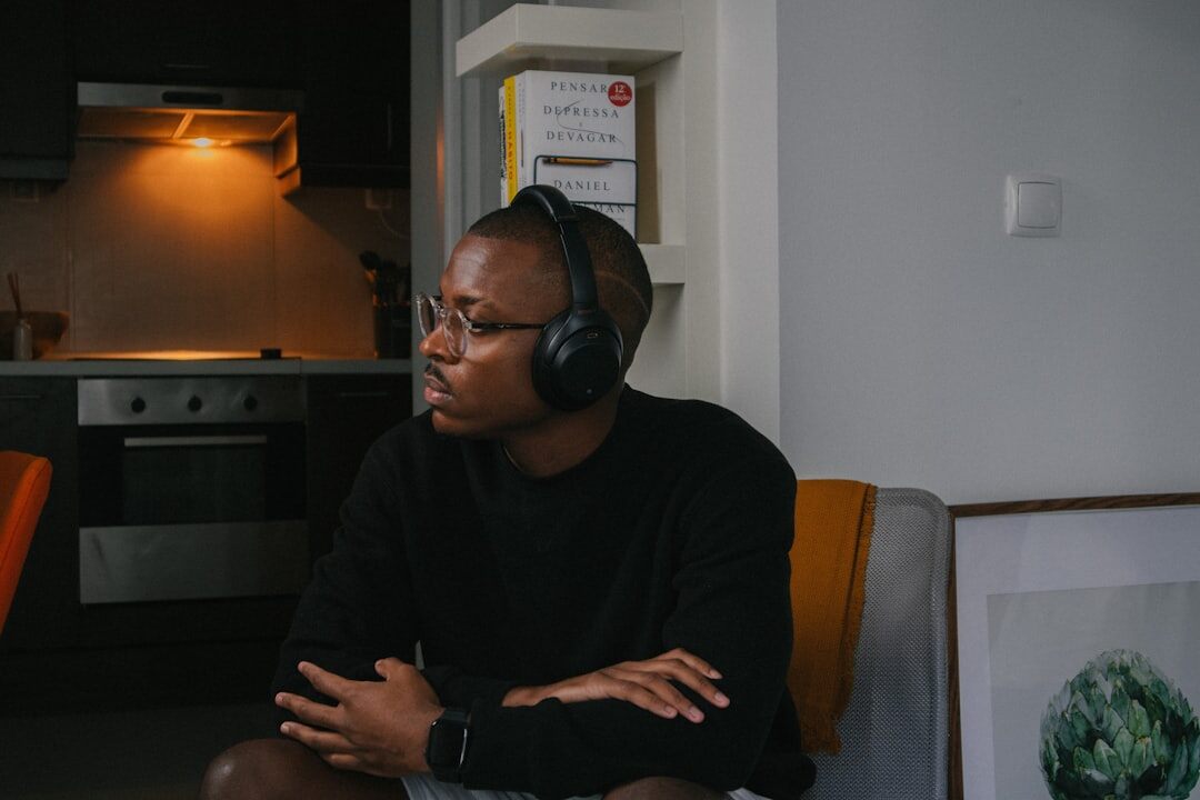 person listening to podcast with headphones